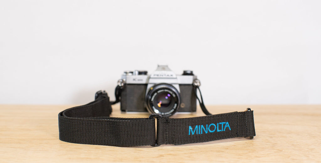 Minolta camera strap in black and blue