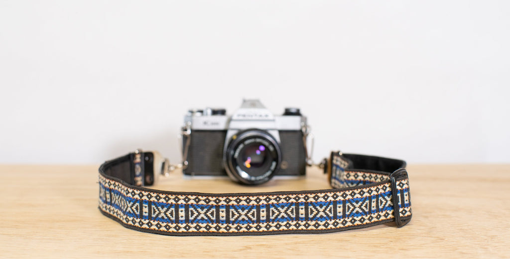 1970's skinny camera strap in shades of blue, black, and white